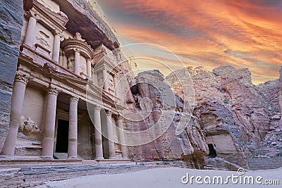 Front of Al-Khazneh in Lost city of Petra, orange sunset sky above Stock Photo