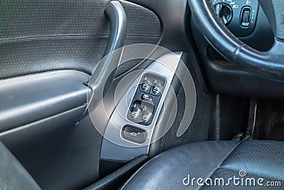 Black leather sedan car interior - german quality, steering wheel, arm rest Stock Photo