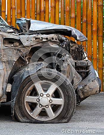 Front of the car demolished with bamboo. Stock Photo