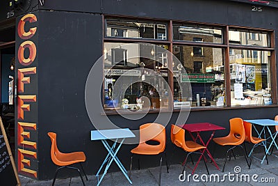 The front of a colorful cafe in East London, England. Editorial Stock Photo