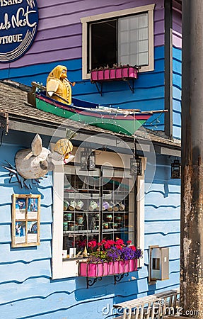 Front of colorful house in the Village Houseboats Fisherman`s Wharf Inner Harbor, Victoria BC, Canada Editorial Stock Photo