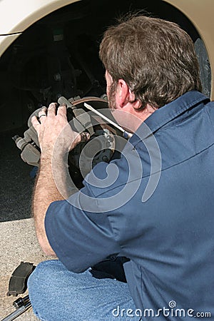 Front Disc Brake Inspection Stock Photo