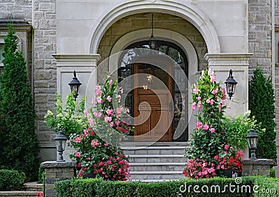 Front door of elegant stone fronted house Stock Photo