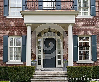 Front door of house with porch Stock Photo