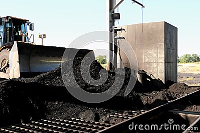 Front End Loader Pushing Coal Into Pulverizer Stock Photo