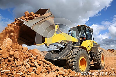 Front End Loader Tipping Stone Stock Photo