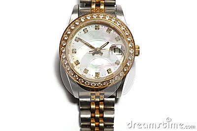 A silver ladies watch with a round watch face and diamonds on the rim Stock Photo