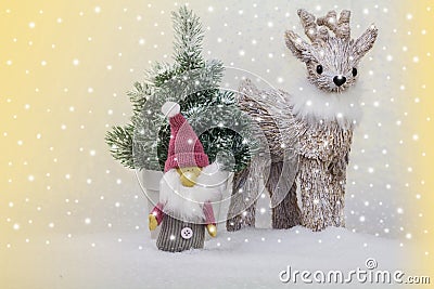 Reindeer and elves in front of the Christmas tree Stock Photo