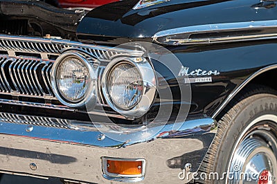 Front and headlight of blue vintage Mercury Meteor car at a show Editorial Stock Photo