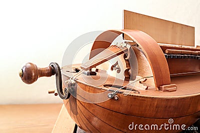 Front of a Hurdy-gurdy, historic musical instrument with strings, keys and crank handle, often used for medieval music Stock Photo