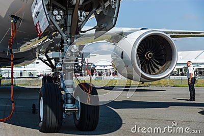 Front landing gear and turbofan Rolls-Royce Trend 900 of the newest airplane Airbus A350-900 XWB. Editorial Stock Photo