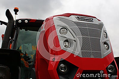 Front mask of modern large agricultural tractor McCormick X7 623 with six round headlights on front. Editorial Stock Photo