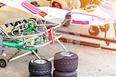 Front metal frame or structure of mini racing car sports go kart or scooter during park at service station after finish Stock Photo