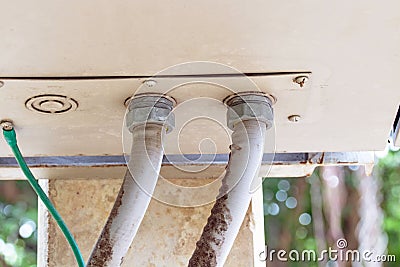 Front network electric cable with metal flex pipe connected under to Internet set-top box by nut. Stock Photo