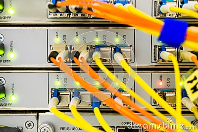 Front panel of the central router. Optical links of a powerful Internet server. Connection of optical wires in the data center Stock Photo