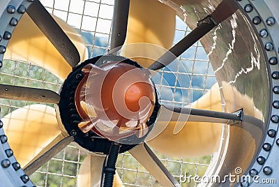 Front part of the snow cannon on a ski slope, detail of the protection mesh and the blades in a duct. Detail of ducted fan of a Stock Photo