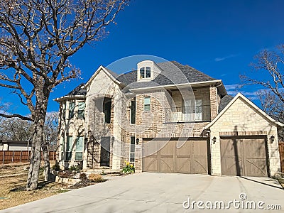 Front porch entrance of newly built 2-story house with attached Stock Photo