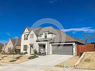 Front porch entrance of newly built 2-story house with attached Stock Photo
