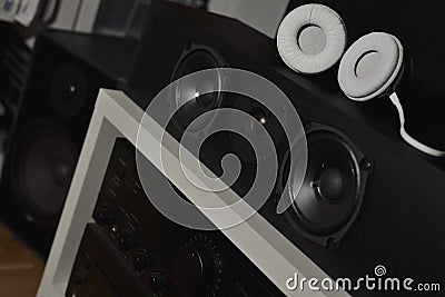 Front speakers from a 7.1 THX Hi-Fi sound system and headphones Stock Photo