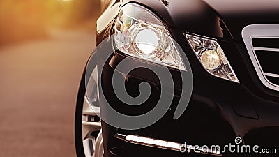 Front of a sports car. Close up detail on one of the headlights modern car. Stock Photo