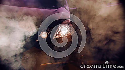 Front of a sports car with smoke. Close up detail on one of the headlights modern car. Stock Photo