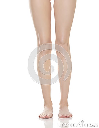 Front view of beautifully cared women`s legs and feet on white background Stock Photo