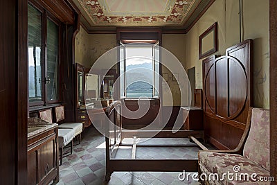 Front view bedroom, bed without mattress and window overlooking the lake and the mountains of Switzerland Stock Photo