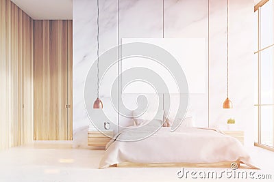 Front view of bedroom: double bed, poster, toned Stock Photo