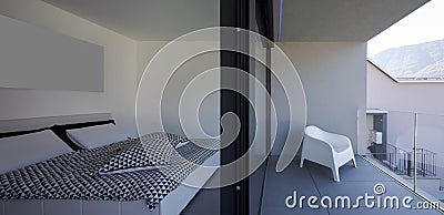 Front view bedroom with open window and terrace on white armchair Stock Photo