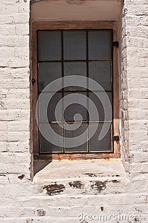 Tropical lighthouse window with twelve glass pains Stock Photo