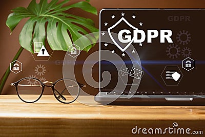 Front view of blank screen laptop, sign general data protection regulation GDPR and shield with key icon, eyeglasses Stock Photo