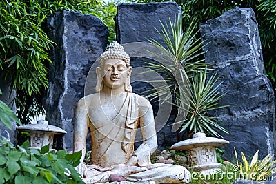 Front view of a Buddha statue made of marble. Enlightment and peace concept Stock Photo