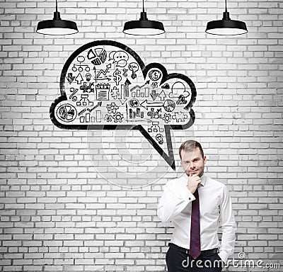 Front view of the confidenman, student, who is thinking about new business concepts. Drawn cloud with business icons on Stock Photo