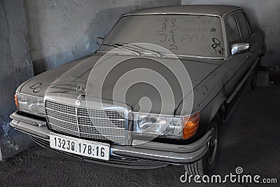 Front view of Dusty and forgotten classic mercedes-benz w201 in garage in Algiers, Algeria, November 12, 2017 Editorial Stock Photo