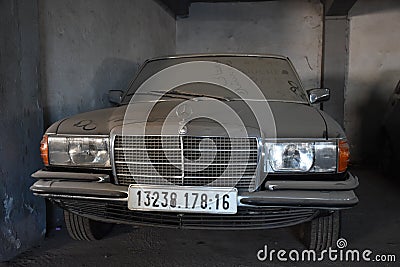 Front view of Dusty forgotten classic mercedes-benz w201 in garage in Algiers, Algeria, November 12, 2017 Editorial Stock Photo