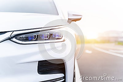 Front view of EV car. New car. White modern car closeup at outside. global warming mitigation concept Stock Photo