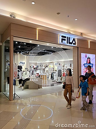 The front view of the 'Fila' shoe store arranges rows of trending shoe models. Editorial Stock Photo