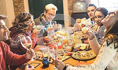 Friends group eating christmas sweets food and having fun at xmas dinner party Stock Photo