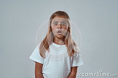 Front view of frightened girl looking at camera Stock Photo