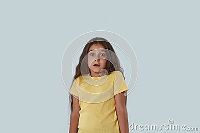 Front view of frightened girl looking at camera Stock Photo