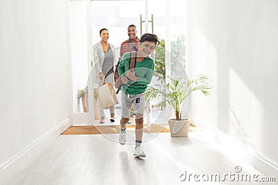 Family entering their house Stock Photo