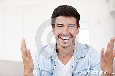 Front view on joyful man to laptop camera starting video communication with friend or partner using video call chat Stock Photo