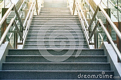 Front view of long stairs going up with bright sunlight. Stock Photo