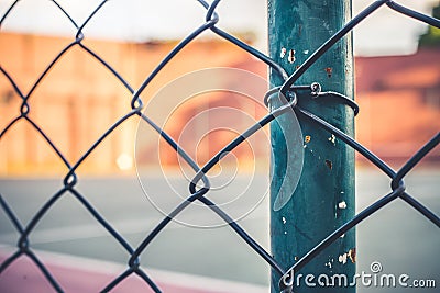 Front view from a metal grid of a sports court. Stock Photo