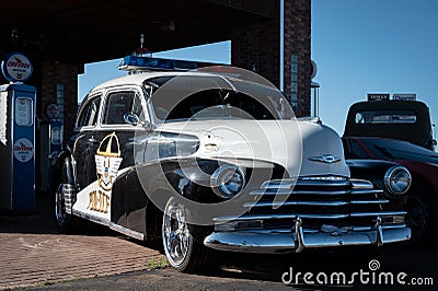 Front view of an old American police car Chevrolet Fleetmaster parked on the street Editorial Stock Photo