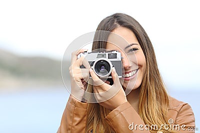 Happy photographer taking photo with a vintage camera Stock Photo