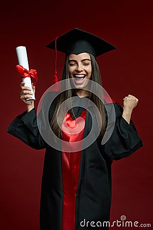Pretty girl smiling, crying, holding diploma, showing hurray. Stock Photo