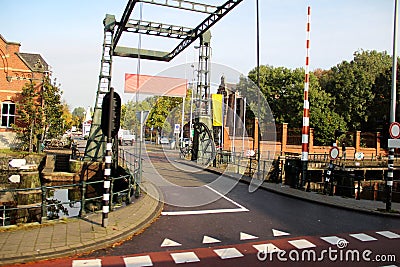 Front view of a road over a bridge of a little canal in amsterdam netherland Stock Photo