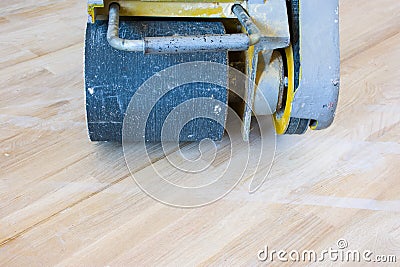 Front view of scraping machine or grinder for process of scraping of wood parquet, hard wood floor or other type of floor is read Stock Photo