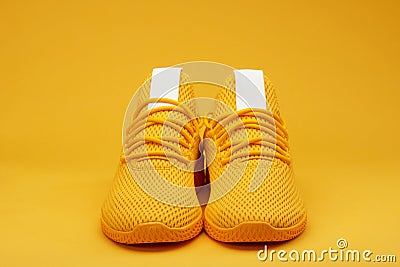 Front view of sport yellow pair shoes Stock Photo